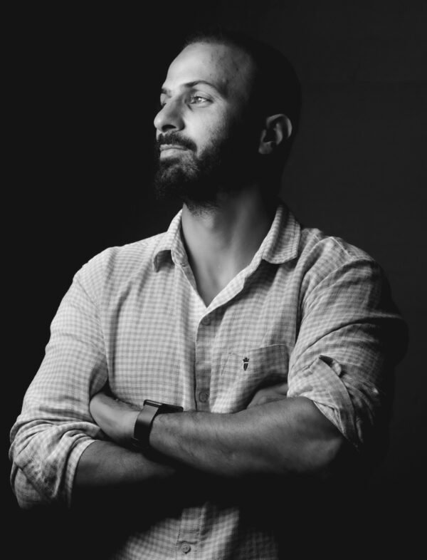 Home Confident man with beard in profile pose