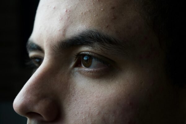 man closeup with black background